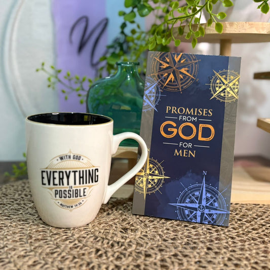 Mug with 'Everything Possible' text and book titled 'Promises from God for Men' on a textured surface.