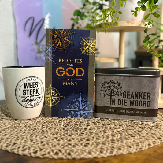 Mug, book, and tin on a textured surface with a blurred background